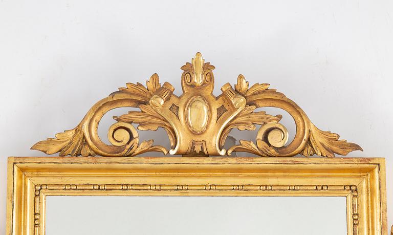 A 19th century two-light mirror sconce.