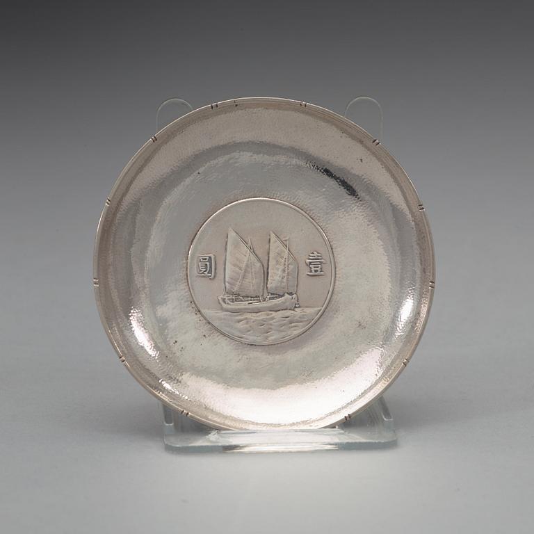 A set of five Chinese silver coasters with chinese silver coins, makers mark Sing Kwong.