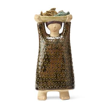 A stig Lindberg stoneware sculpture av woman carrying a a basket of fish, Gustavsberg studio, Sweden probably 1960's.