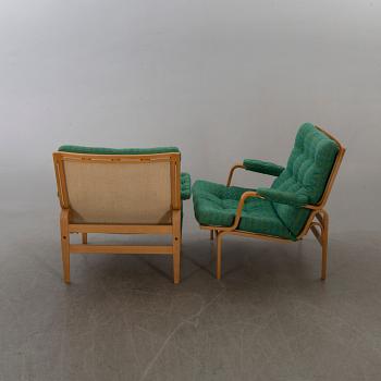 BRUNO MATHSSON, a pair  of easy chairs "Ingrid" for DUX.