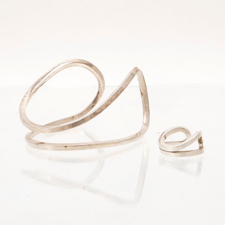 A silver ring and bracelet "loop cuff" by Efva Attling.