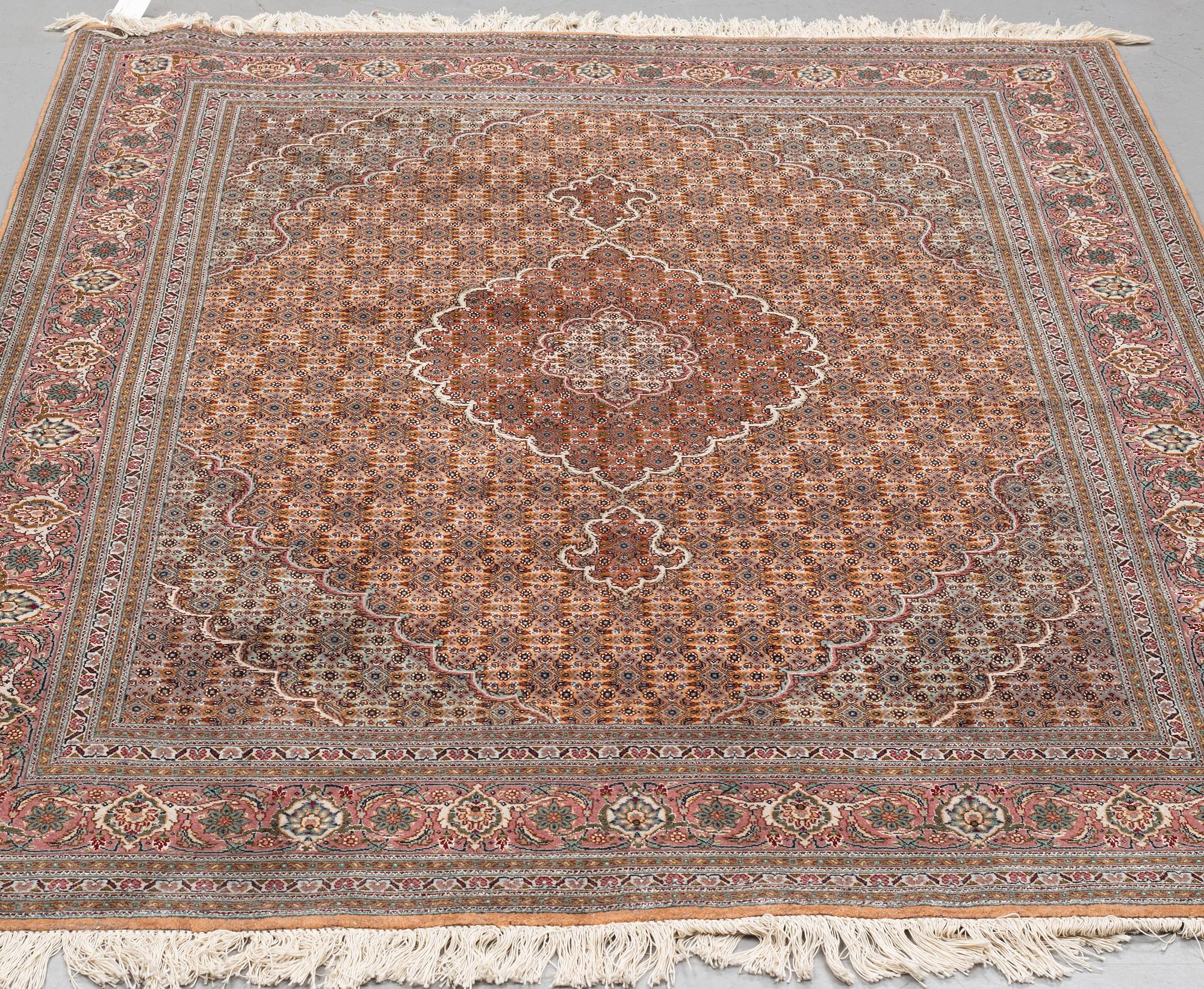 A RUG, Old Tabriz, part silk, ca 201 x 152 cm.