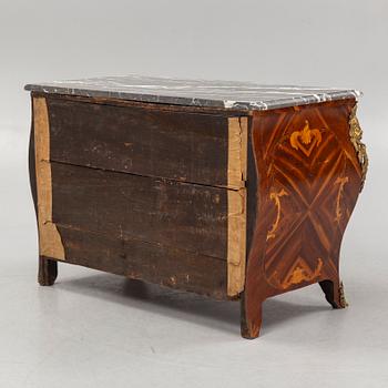 A French Louis XV marquetry and gilt-bronze mounted commode 'Aux bustes de femmes", later part of the 18th century.