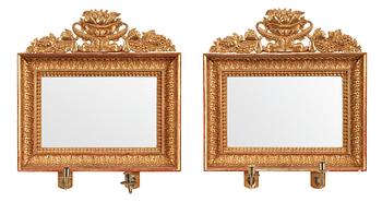 478. A pair of Swedish Empire first half 19th century two-light girandole mirrors.