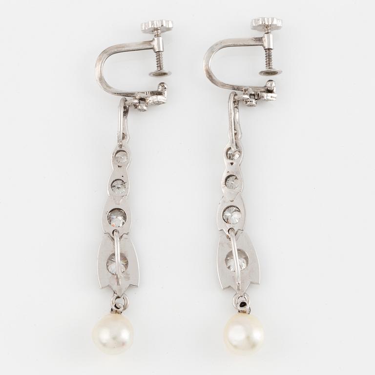 A pair of 18K white gold brilliant-cut and pearl earrings.