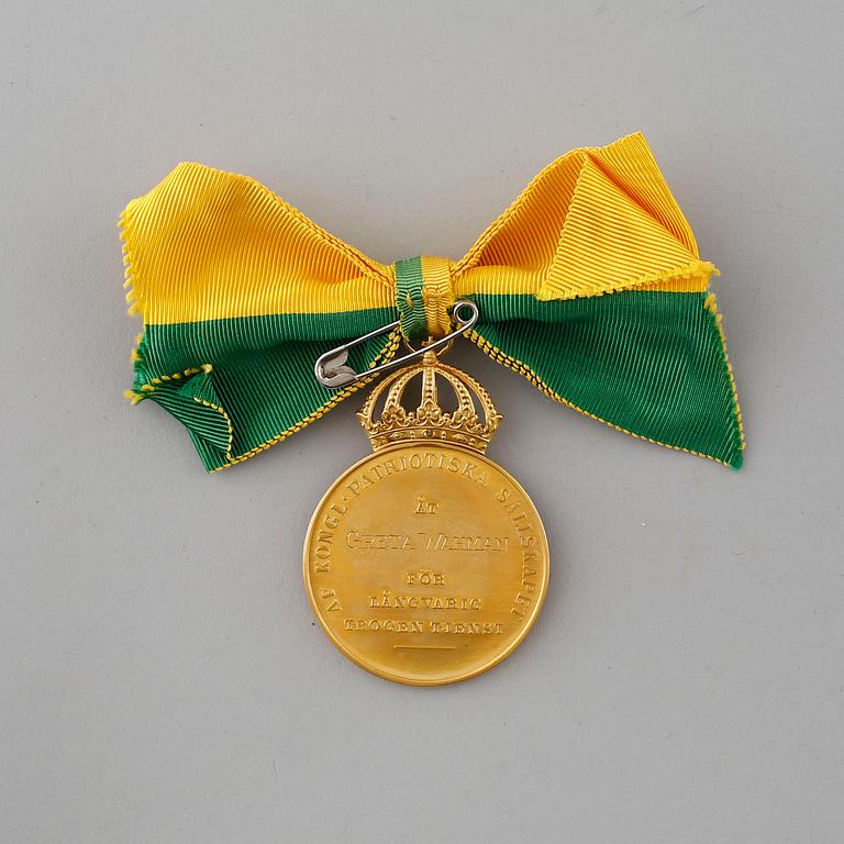 A Royal gold Swedish medal from the Kungliga patriotiska sällskapet, 1961.