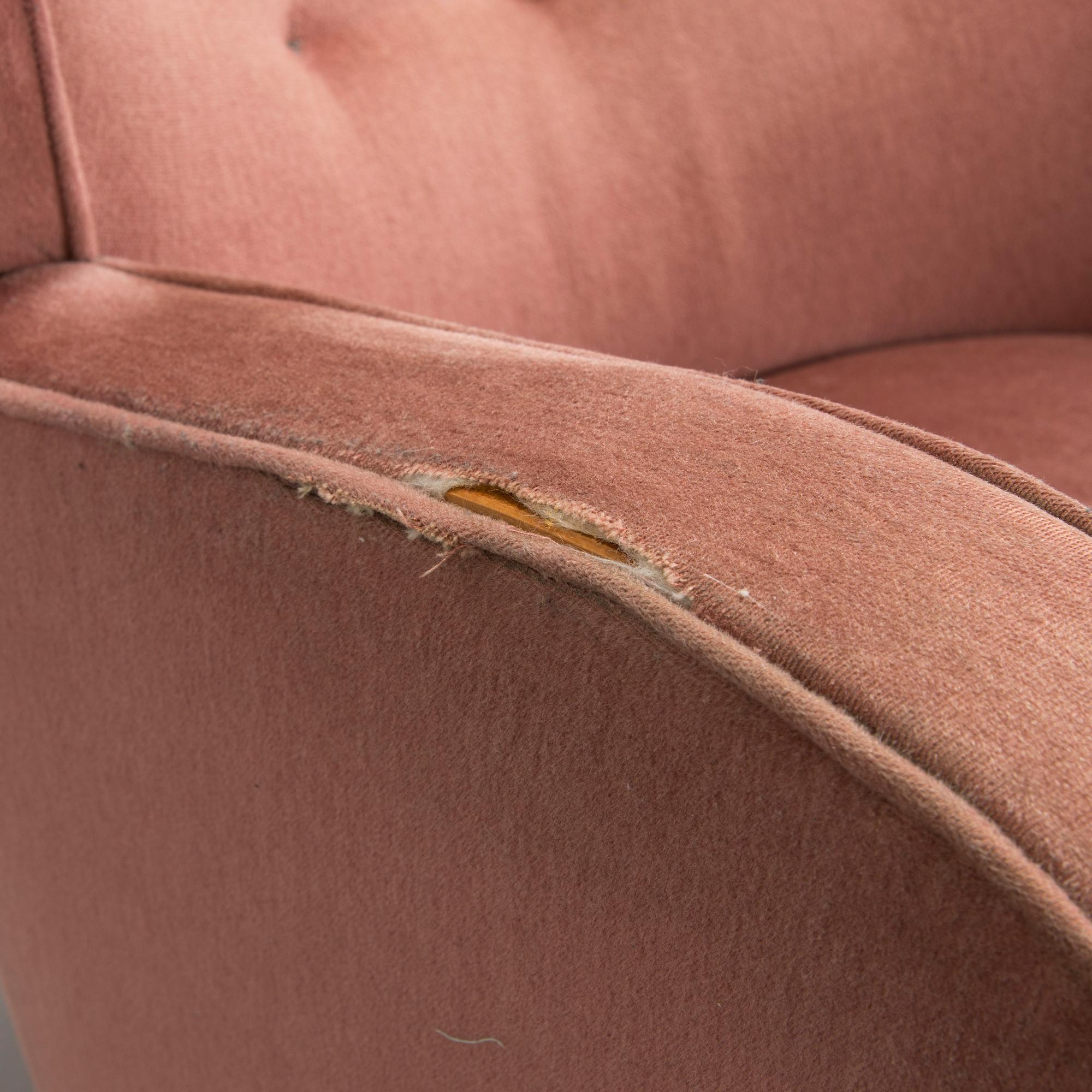 A pair of mid-20th century armchairs.