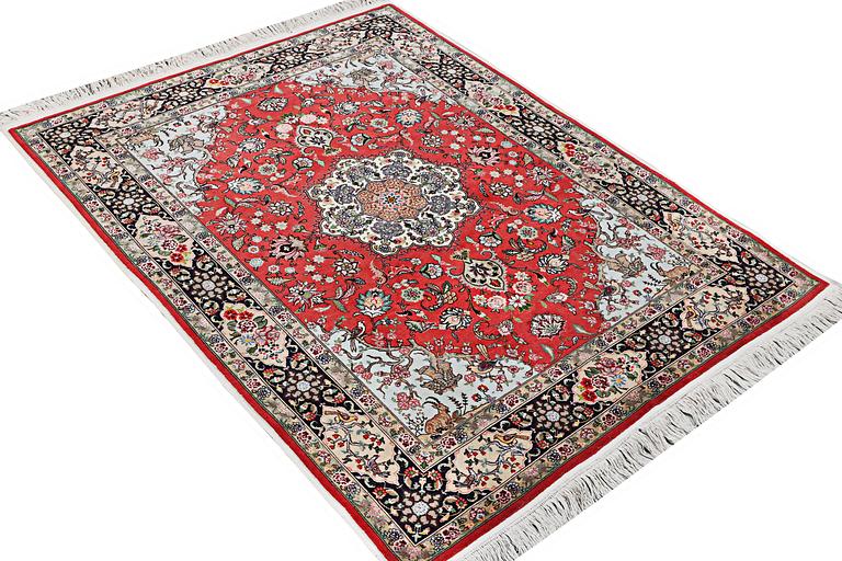 A carpet, Tabriz, part silk, c. 202 x 152 cm.
