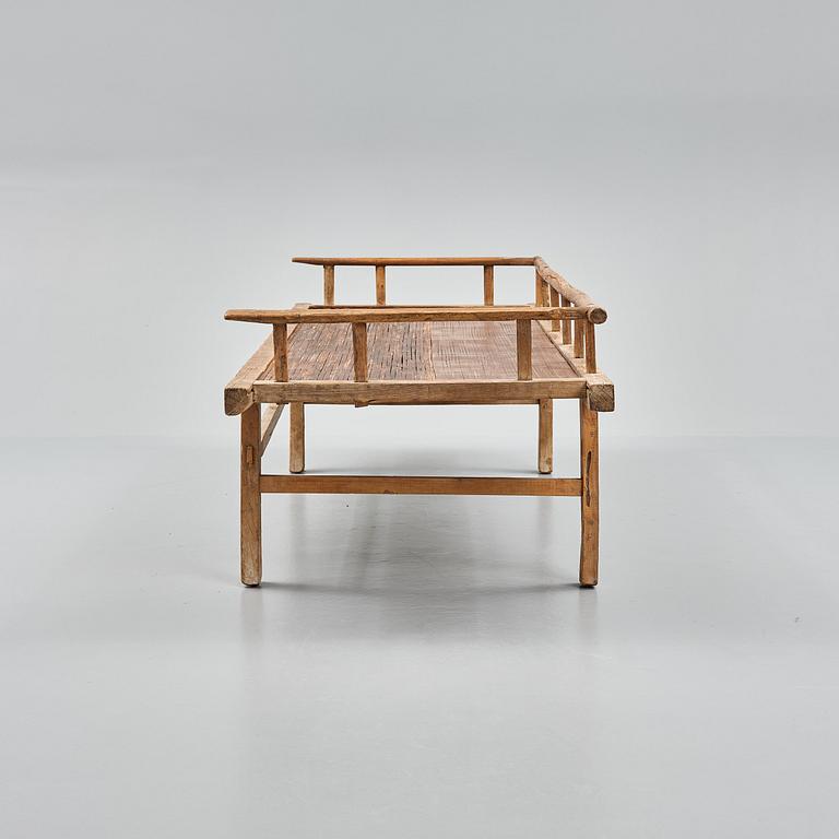 A wooden daybed, South East Asia.