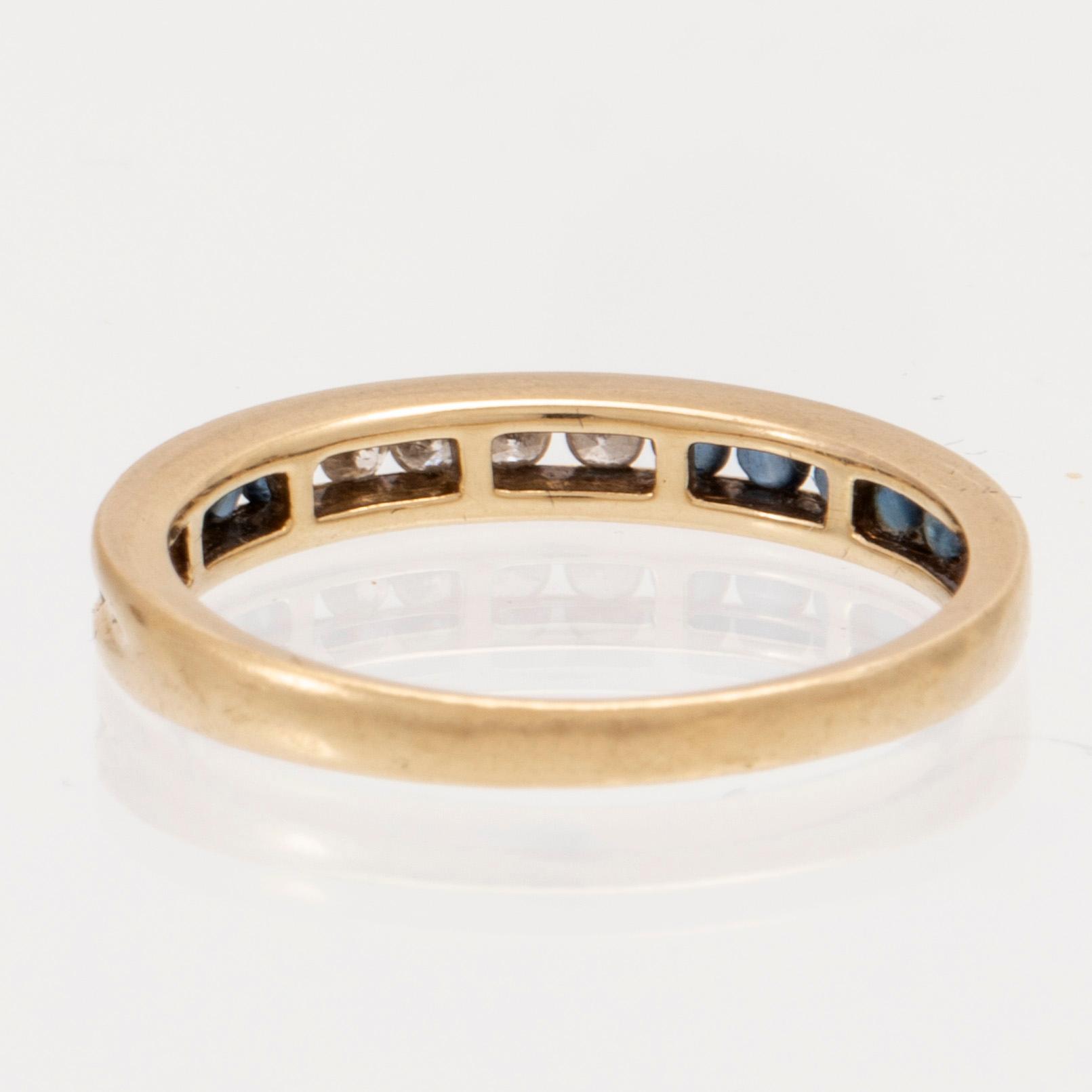 An 18K gold ring and a pair of earrings by H. Stern set with round brilliant cut diamonds and sapphires.