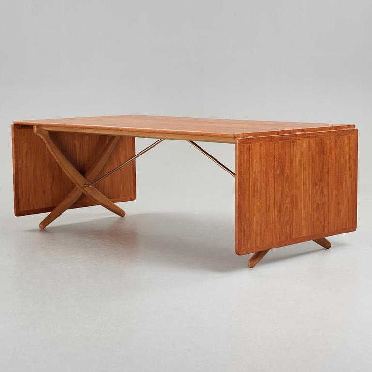 Hans J. Wegner, a teak, beech and brass dining table by Andreas Tuck, "AT-314", Denmark 1950-60's.