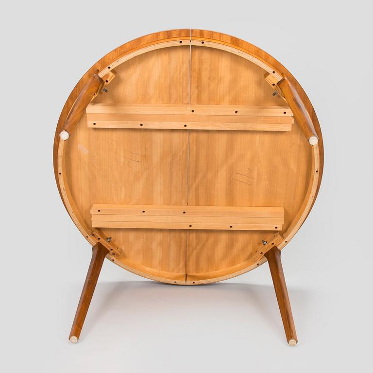 A 1960s teak and oak dining table.