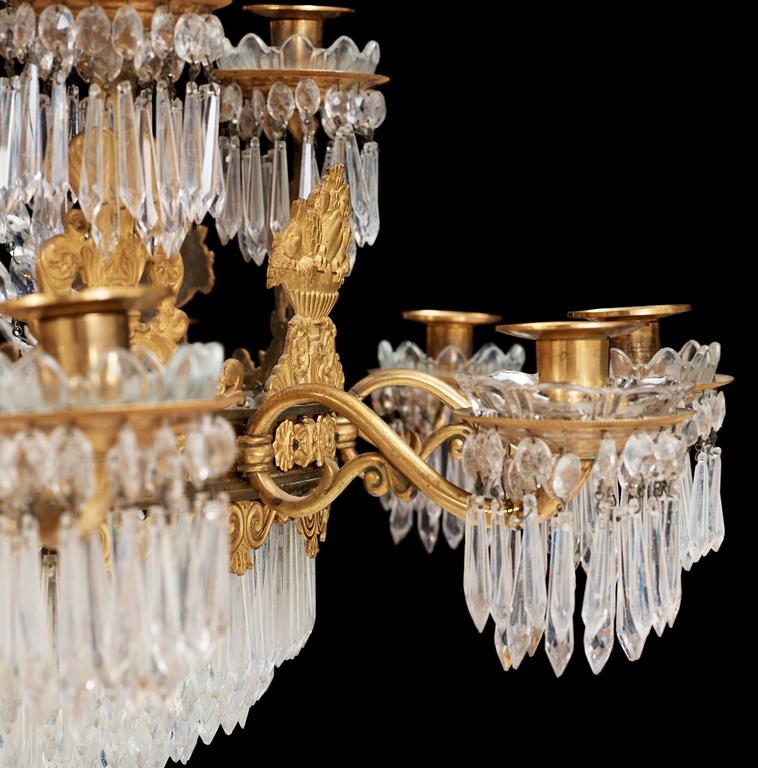 An Empire first half 19th century eighteen-light gilt bronze chandelier.