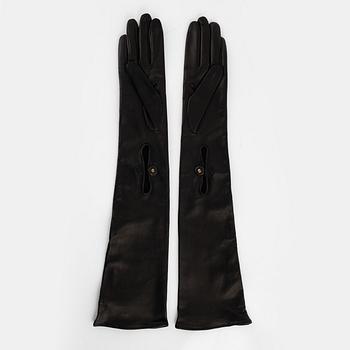 Prada, a pair of black leather gloves, size 6 1/2.