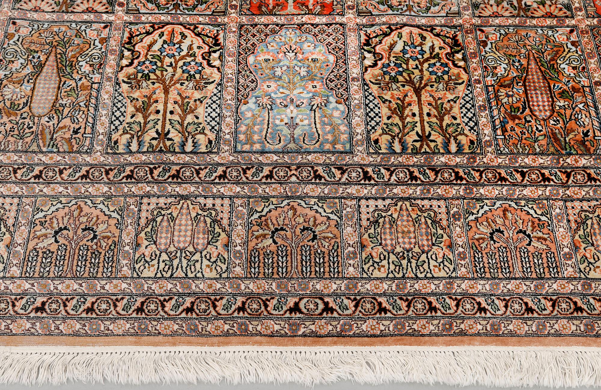 A silk Kashmir carpet, approx. 327 x 243 cm.