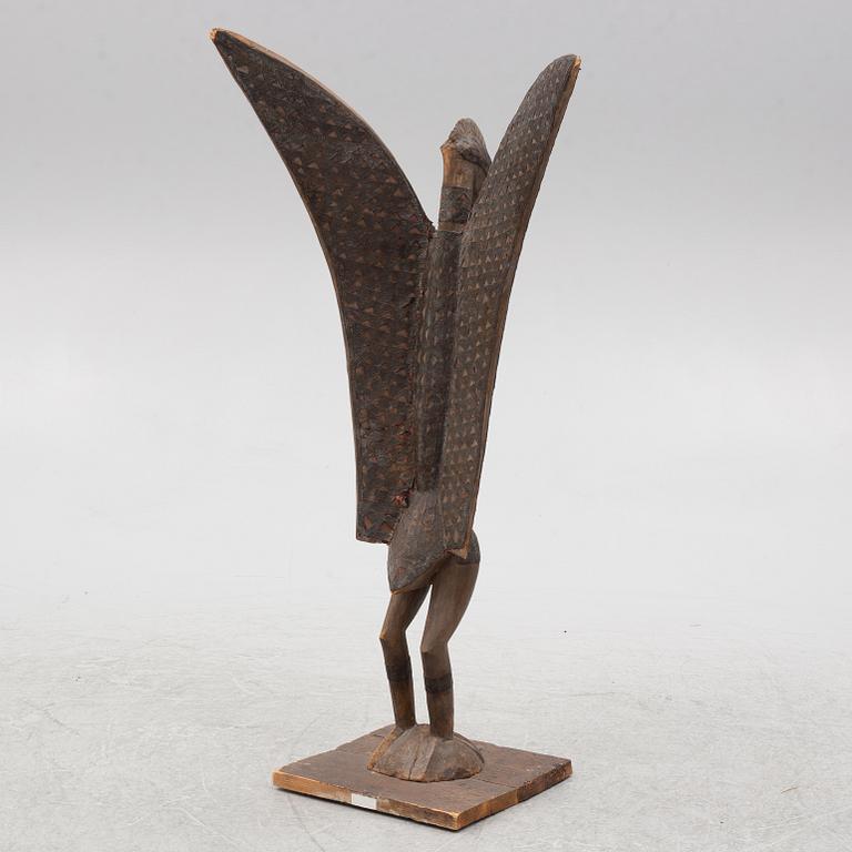 A sculpture, likely Ivory Coast, 20th century.