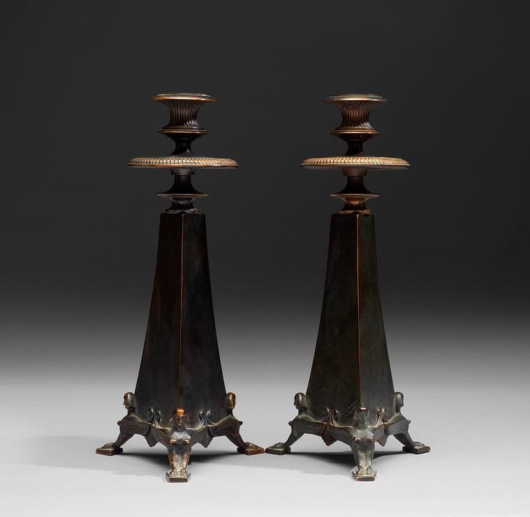 A pair of Melchior Wernstedt bronze candelsticks, foundry Herman Bergman AB.