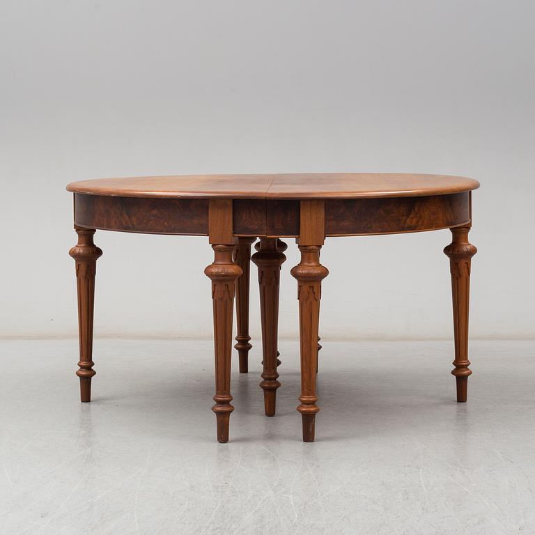 A DINING TABLE, second half of the 19th century. 5 painted leaves included.
