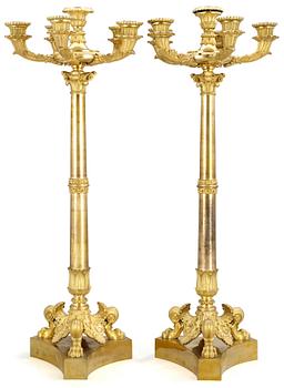 946. A pair of late Empire five-light candelabra.
