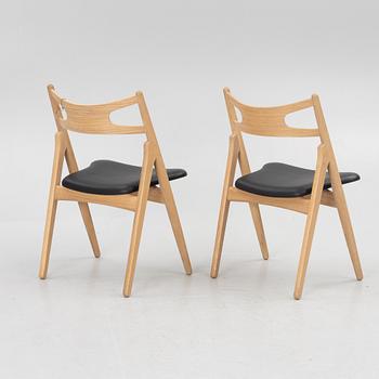 Hans J Wegner, a pair of chairs, model CH 29 "The Savbuk Chair", Carl Hansen.