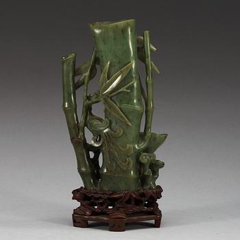 A  carved green stone sculpture, late Qing dynasty.