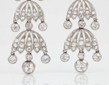 A pair of chandelier diamond earrings. Old- and rose-cut diamonds, total carat weight circa 7.50 cts.