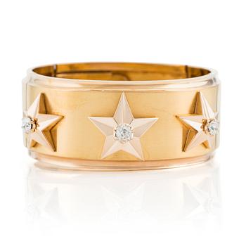 An 18K gold bracelet set with old-cut diamonds.
