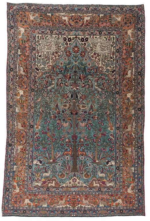 A CARPET, a semi-antique Teheran figural, 303,5 x 198-205,5 cm.