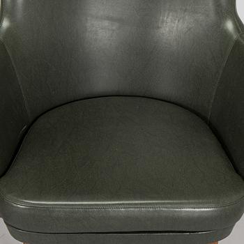A pair of mid-20th century armchairs.