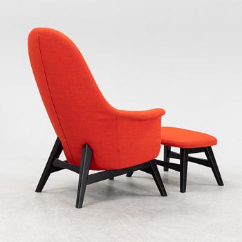 A 'Benarp/Genua easy chair with foot stool from Ikea,.
