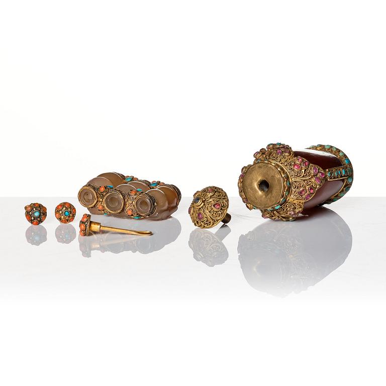 A set of four Chinese snuff bottles and a sculpture, 20th Century.