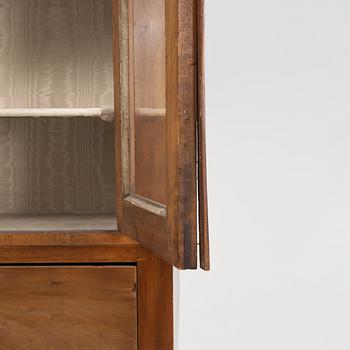 A mahogany veneered book cabinet. 19th Century.