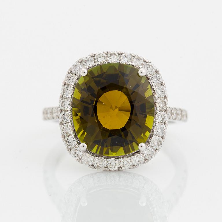 Yellow green tourmaline and brilliant cut diamond cocktail ring.