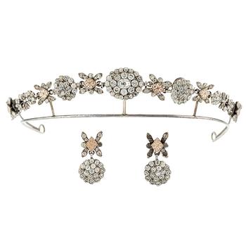 571. A silver and paste demi parure comprising a tiara and a pair of earrings, 19th century.