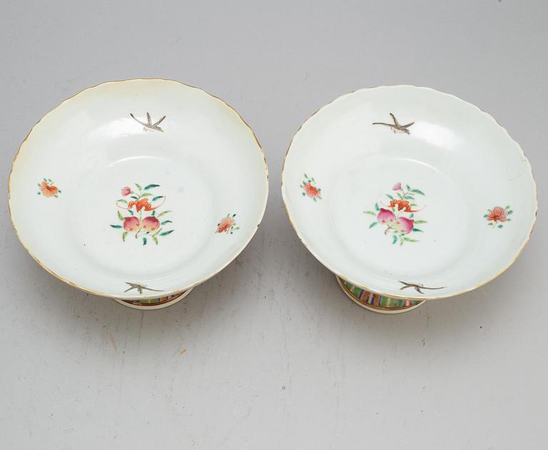 A pair of famille rose footed dishes, Qing dynasty, Canton, 19th century.