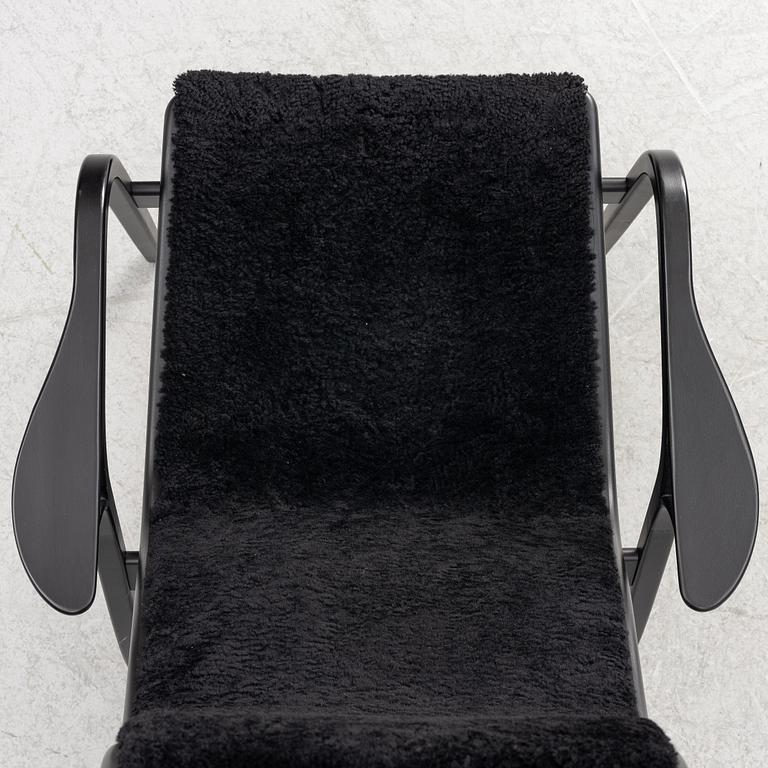Yngve Ekström, a  'Lamino' easy chair with foot stool, Swedese, 2018.