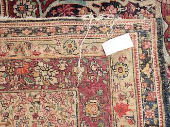 An antique Kerman Laver carpet, c. 586 x 385 cm.