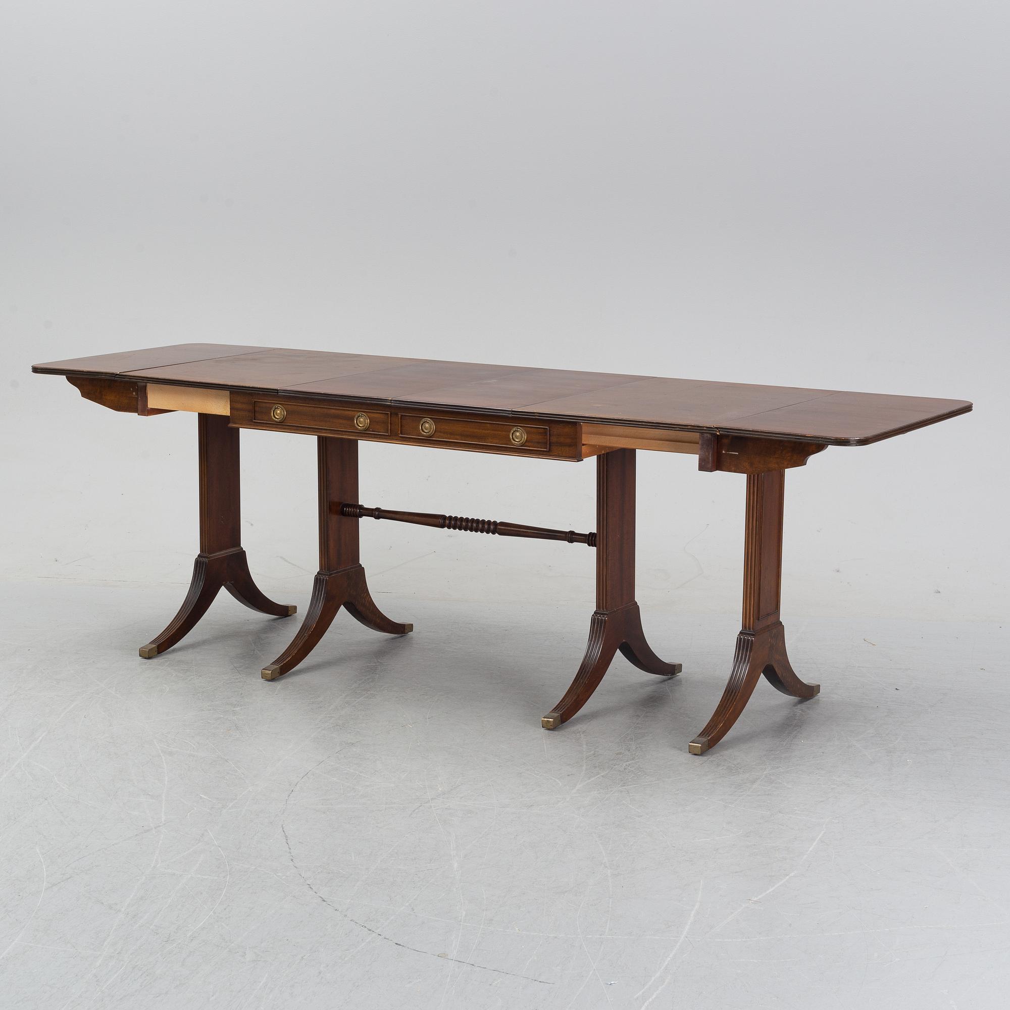 A mahogany dining table with folding and additional leaves, Nordiska Kompaniet, designed 1945.