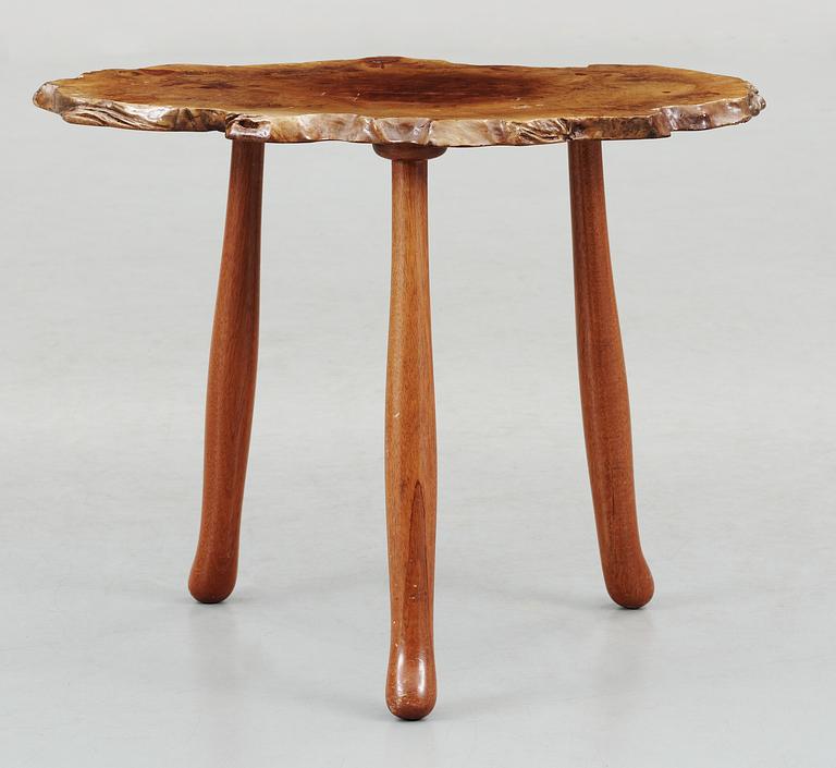 A Josef Frank elmroot and mahogany table by Svenskt Tenn.