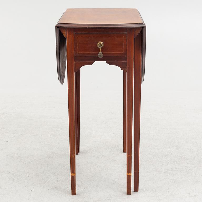 A drop-leaf table, England, early 20th Century.