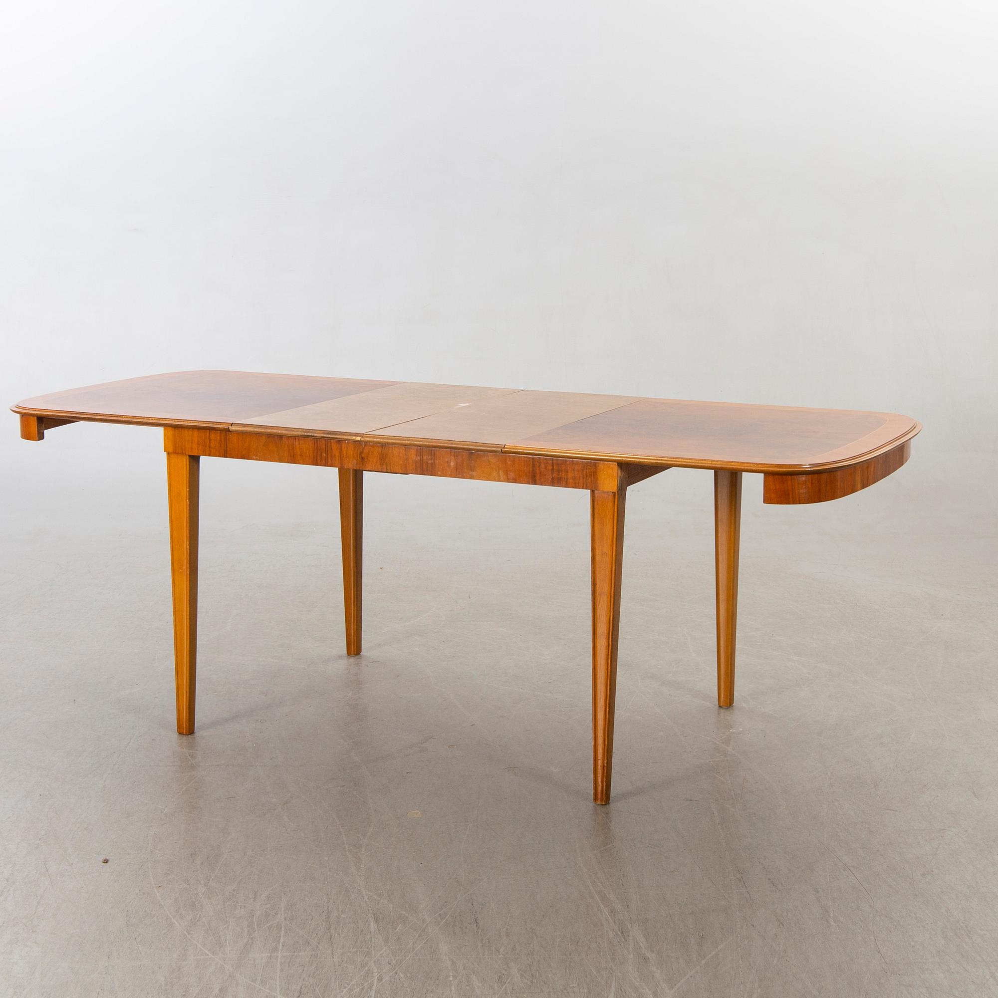 A 1950/60's dining table and chairs.