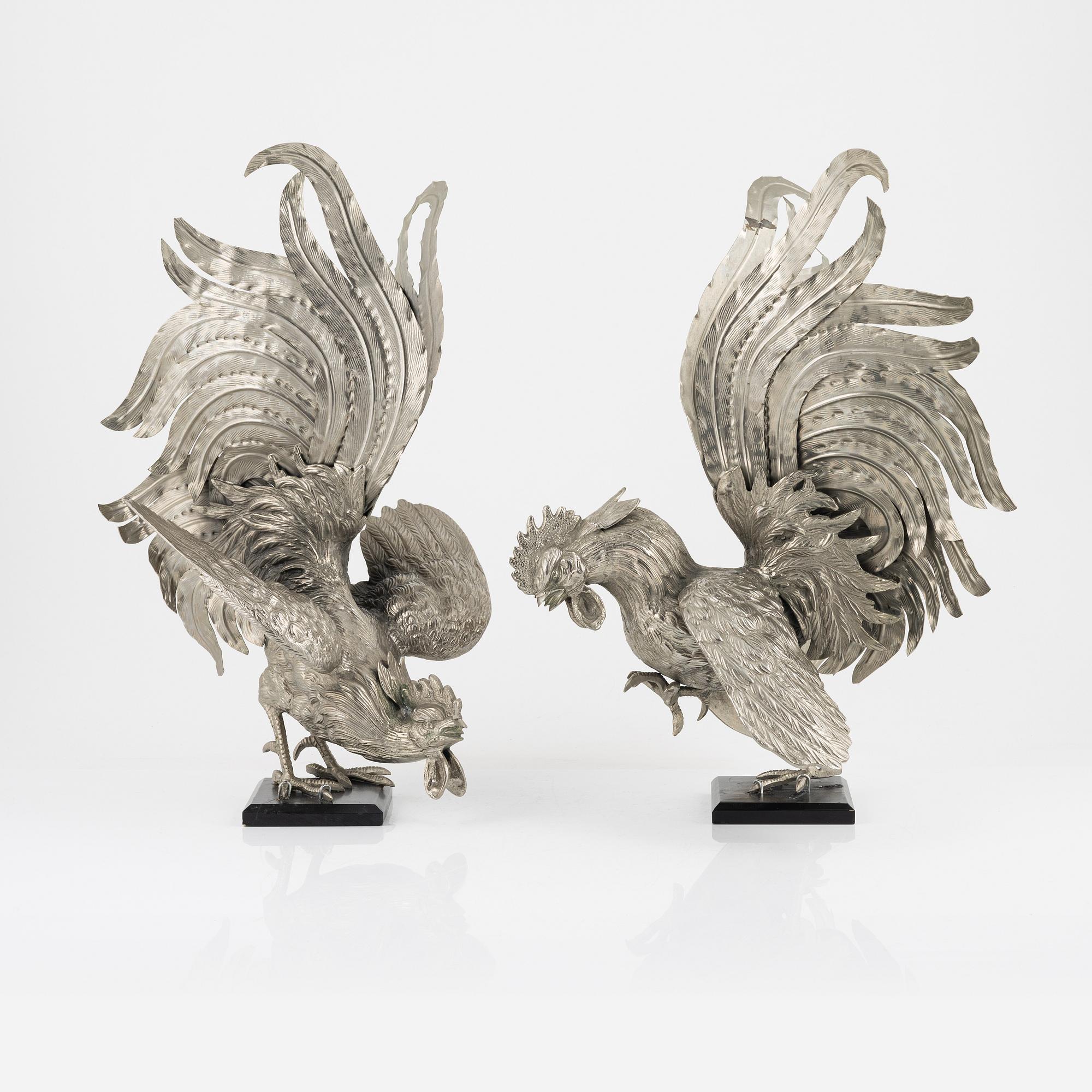 A pair of metal table decorations, 20th century.