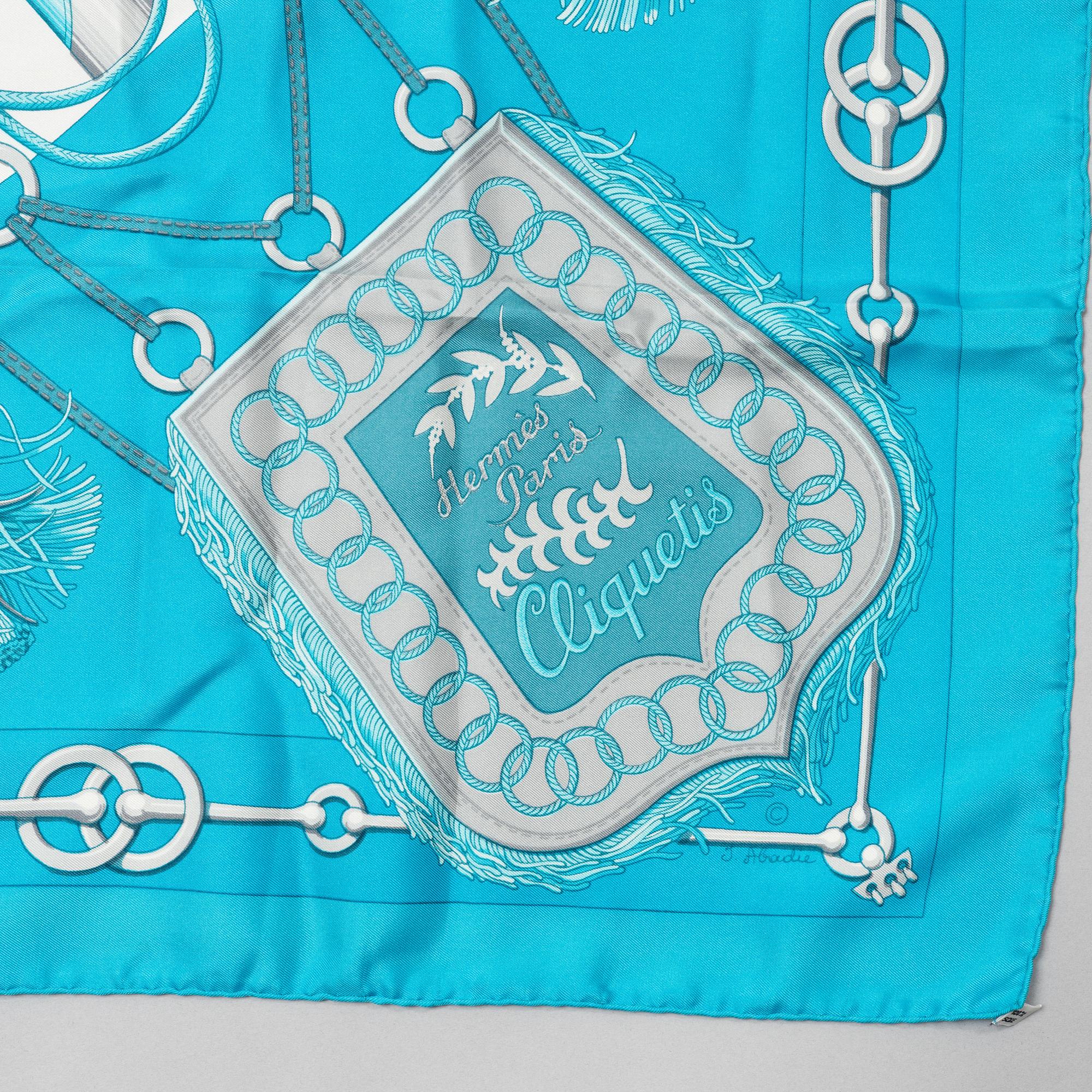 Hermès, a 'Cliquetis' silk scarf.