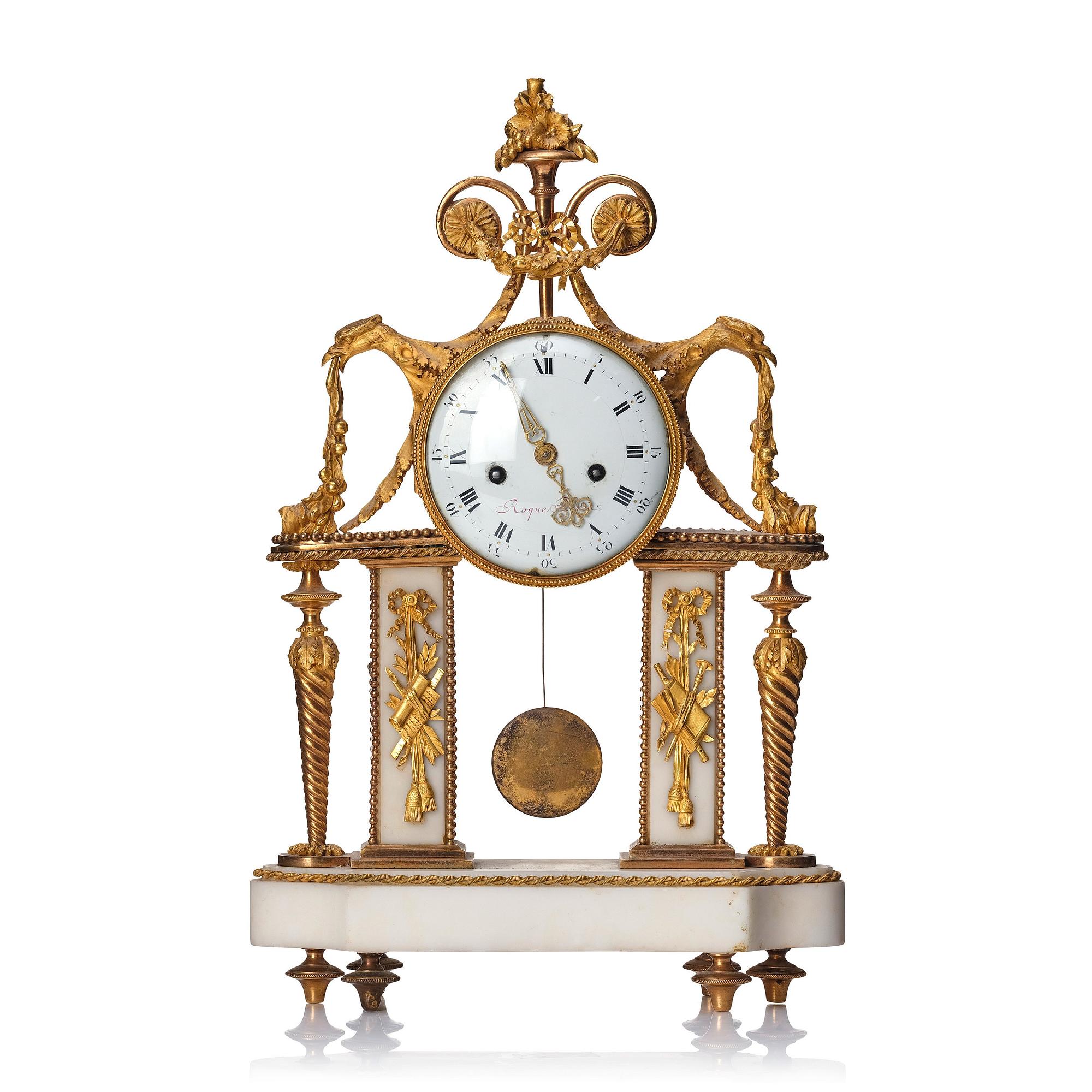 A Louis XVI gilt bronze and white marble mantel clock, late 18th century.