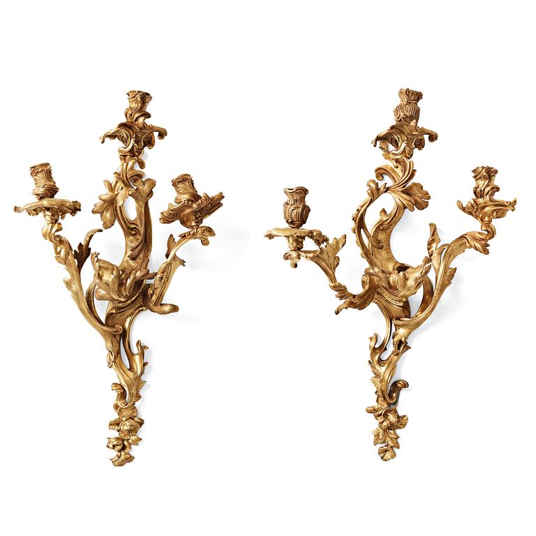 A pair of Louis XV mid 18th century three-light wall-lights.