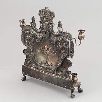 A 19th century silver chanukka-lamp.