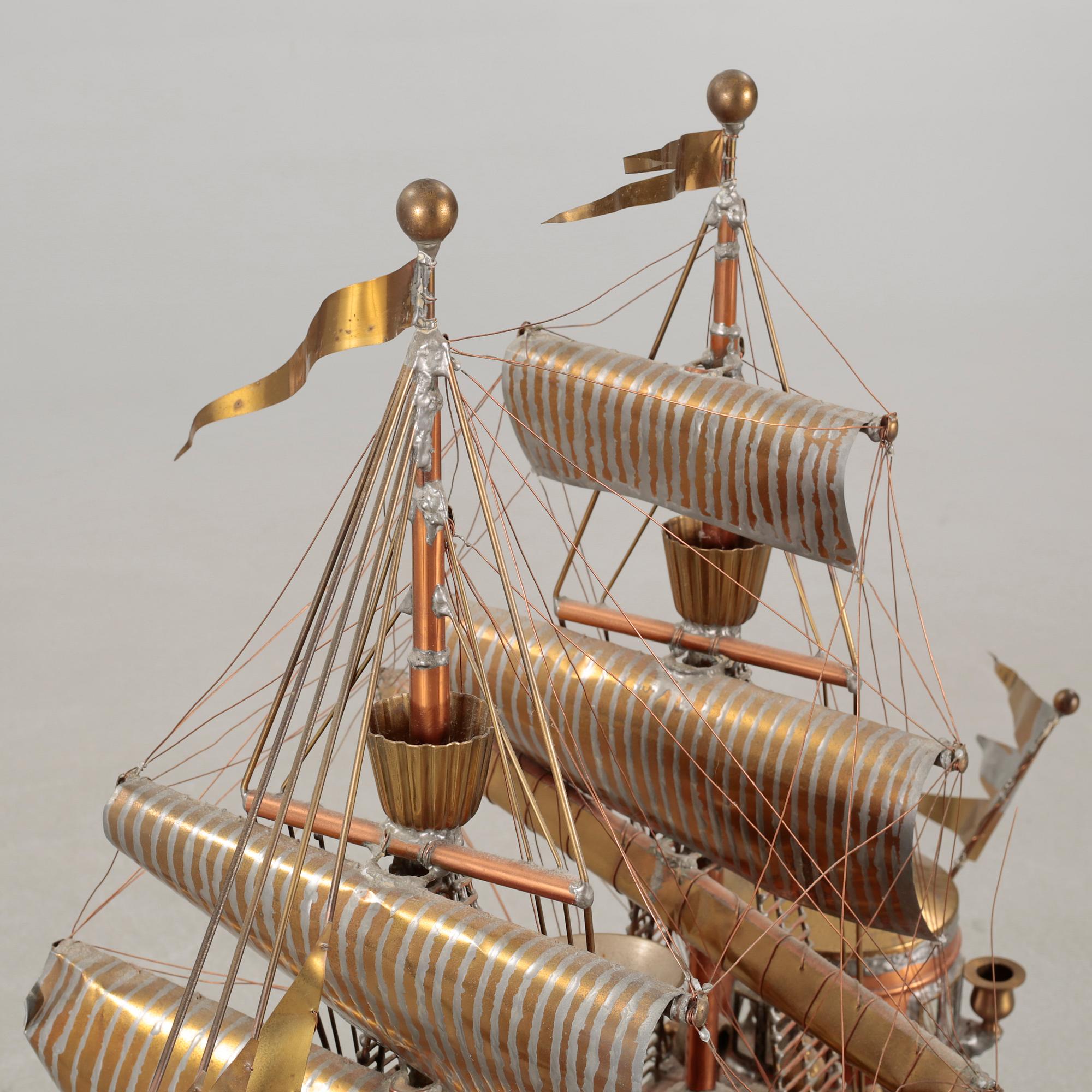 A boat sculpture, dated -75.