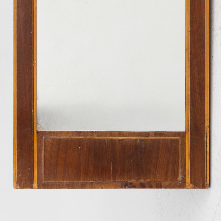 An Empire style mirror, second half of the 20th century.