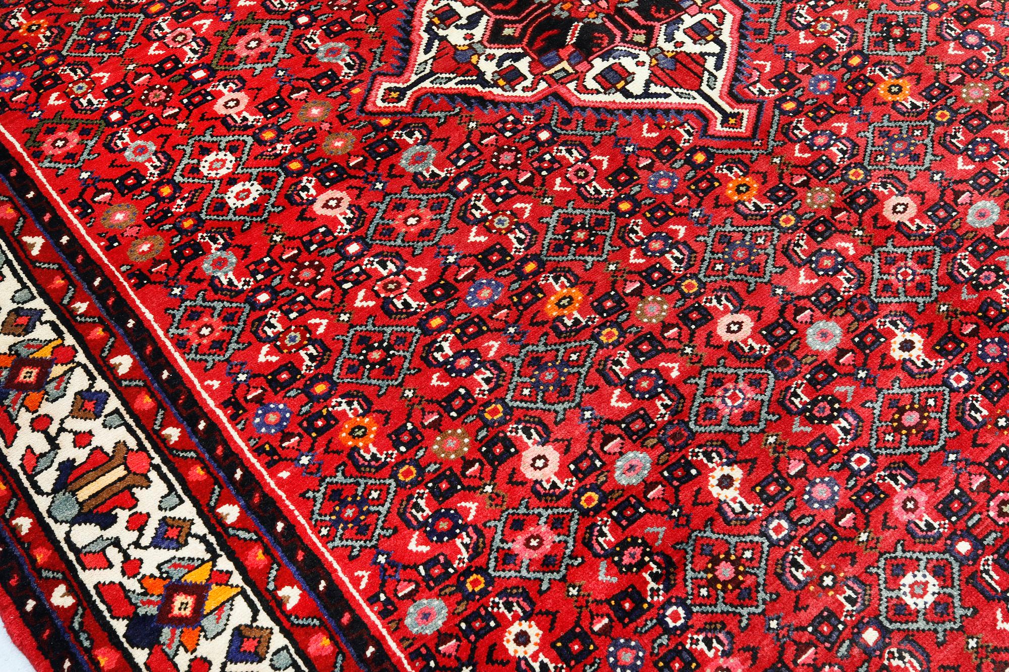 A Hosseinabad carpet, c 301 x 215 cm.