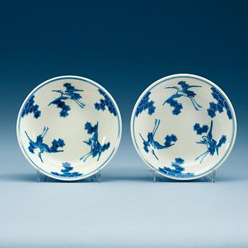 A pair of Japanese blue and white crane dishes, presumably 19th Century.